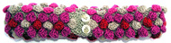 R�tstickat pannband med rosa, beige och r�da moucher p� beige botten